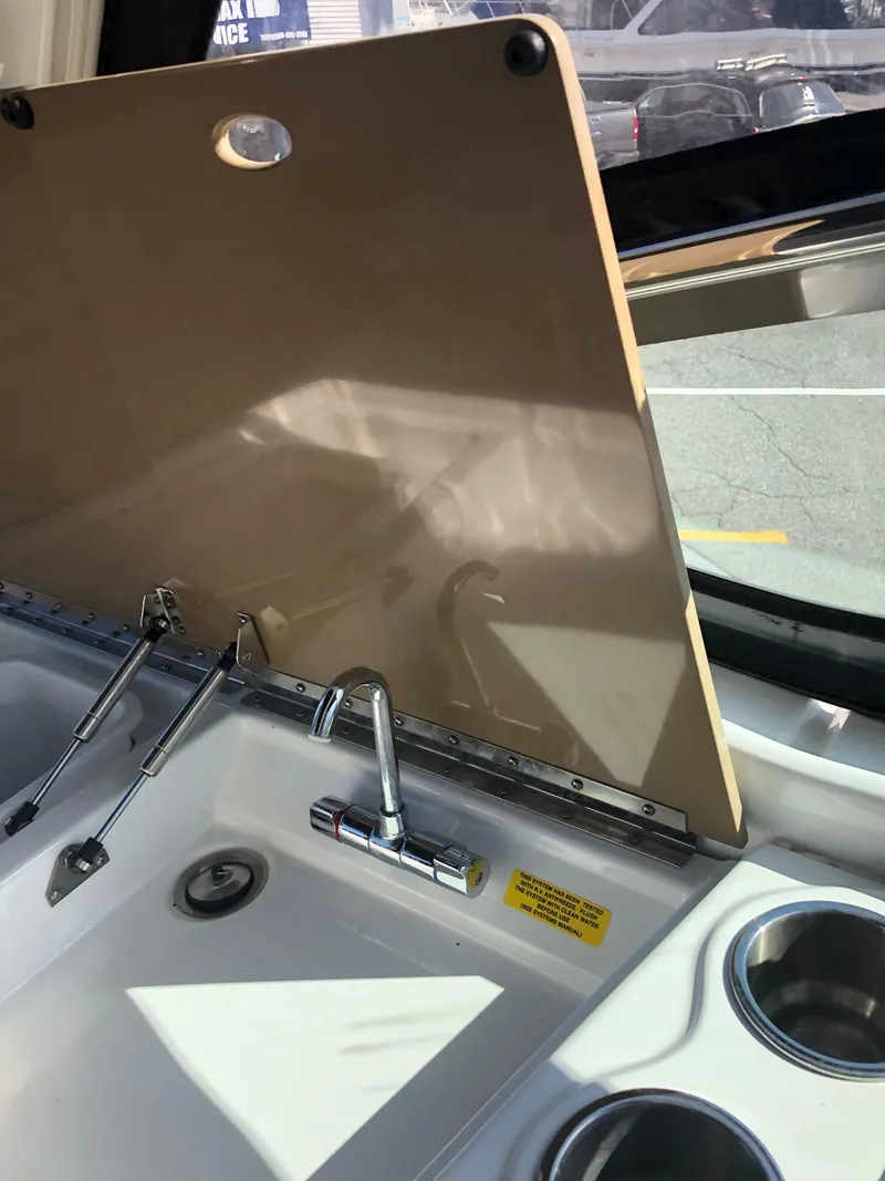 Slide: The Image of 2013 Formula 350 Sun Sport boat sink and faucet with cover open. - 33