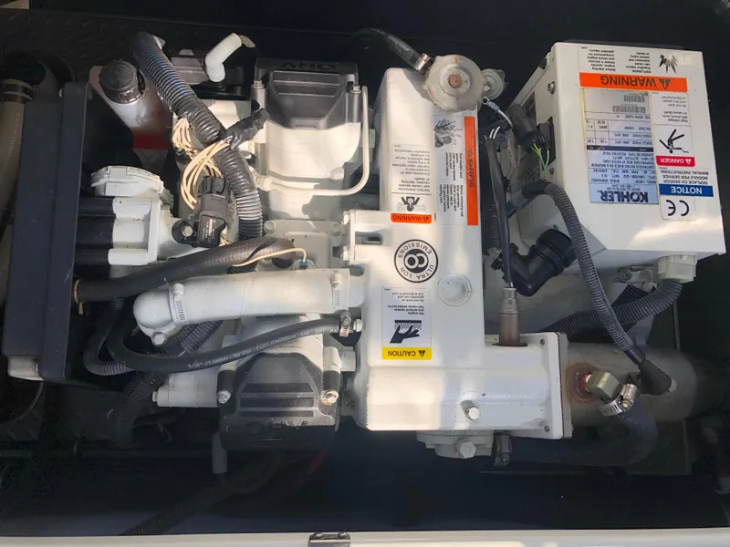 Slide: The Image of Engine compartment of a 2013 Formula 350 Sun Sport boat, featuring various mechanical components. - 36