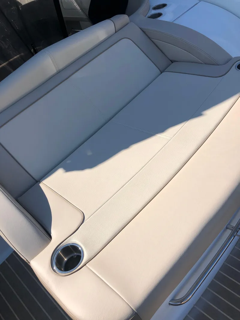 Slide: The Image of 2013 Formula 350 Sun Sport boat with beige leather seating and cup holder. - 40