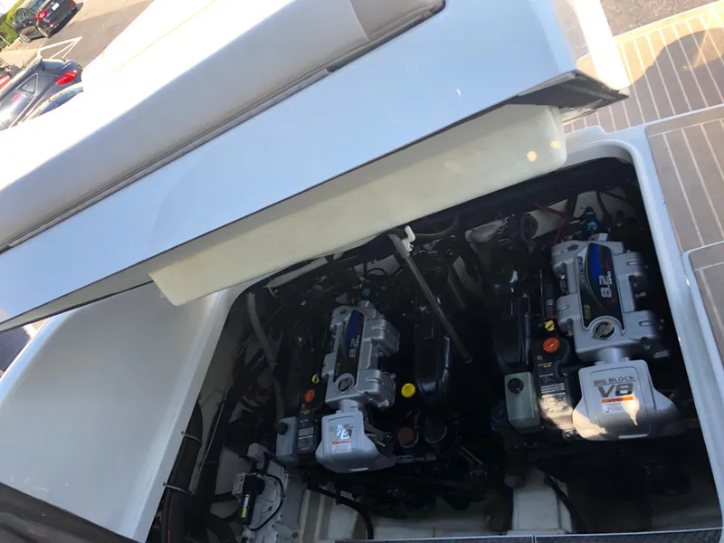 Slide: The Image of Engine compartment of a 2013 Formula 350 Sun Sport boat, showcasing dual V8 engines. - 47