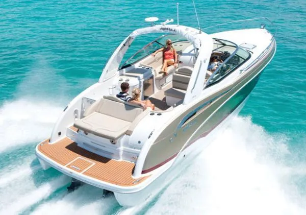 Slide: The Image of 2013 Formula 350 Sun Sport cruising on clear turquoise water. - 48