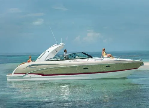 Slide: The Image of 2013 Formula 350 Sun Sport boat cruising on clear blue waters. - 49