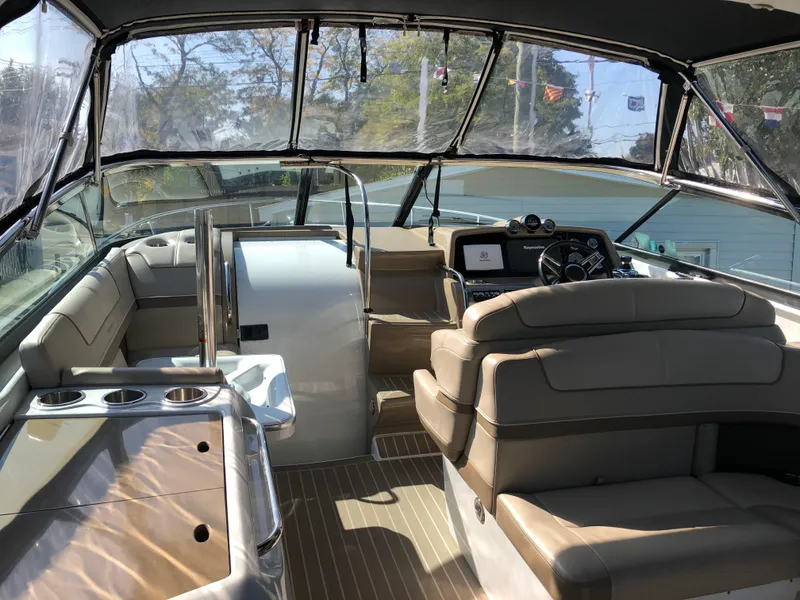 Slide: The Image of 2013 Formula 350 Sun Sport boat interior with seating and dashboard. - 6