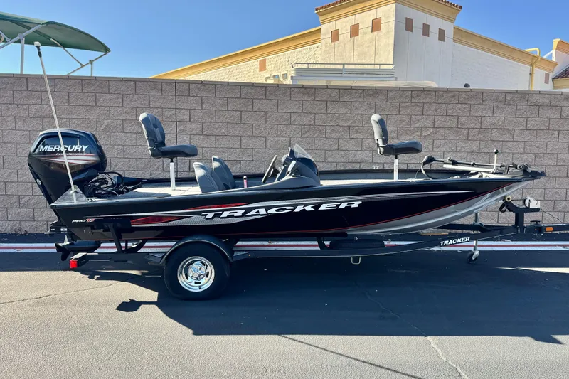 The Image of 2019 Tracker Pro Team 175 boat with Mercury engine, parked on a trailer. - 0