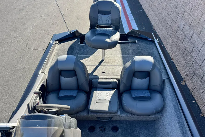 Slide: The Image of 2019 Tracker Pro Team 175 boat interior with gray seating and steering wheel. - 13
