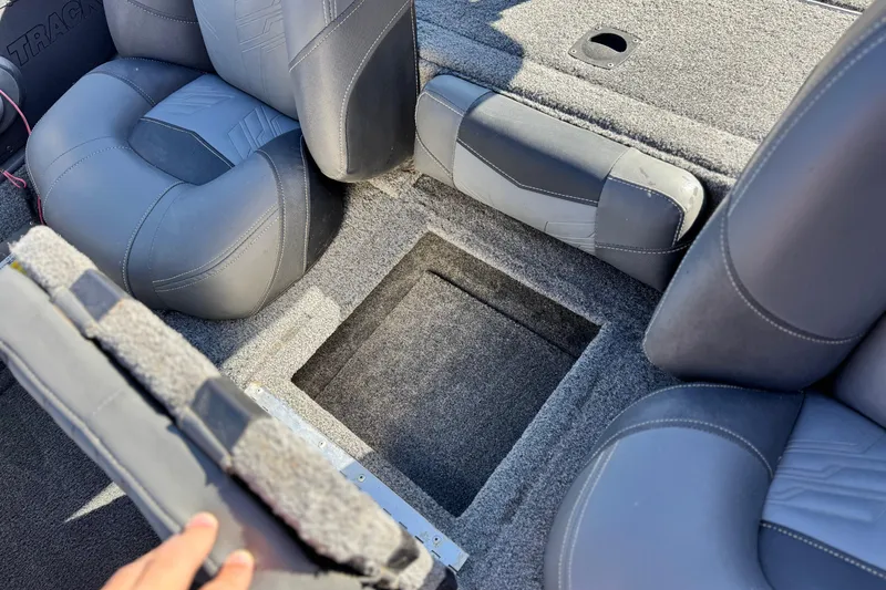 Slide: The Image of 2019 Tracker Pro Team 175 boat interior with open storage compartment. - 14