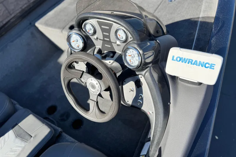 Slide: The Image of 2019 Tracker Pro Team 175 boat dashboard with Lowrance Hook system and gauges. - 19