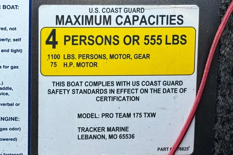 Slide: The Image of 2019 Tracker Pro Team 175 capacity label, 4 persons or 555 lbs, US Coast Guard compliant. - 22