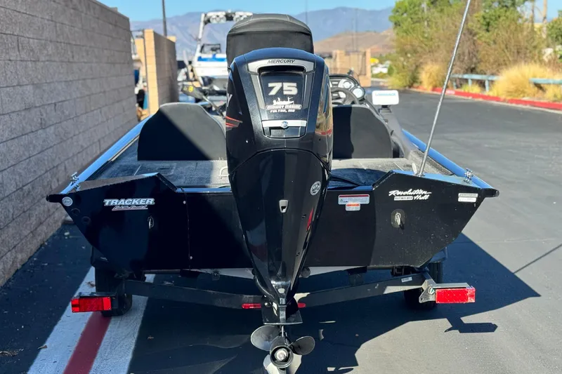 Slide: The Image of 2019 Tracker Pro Team 175 boat with Mercury 75 engine, parked outdoors. - 4