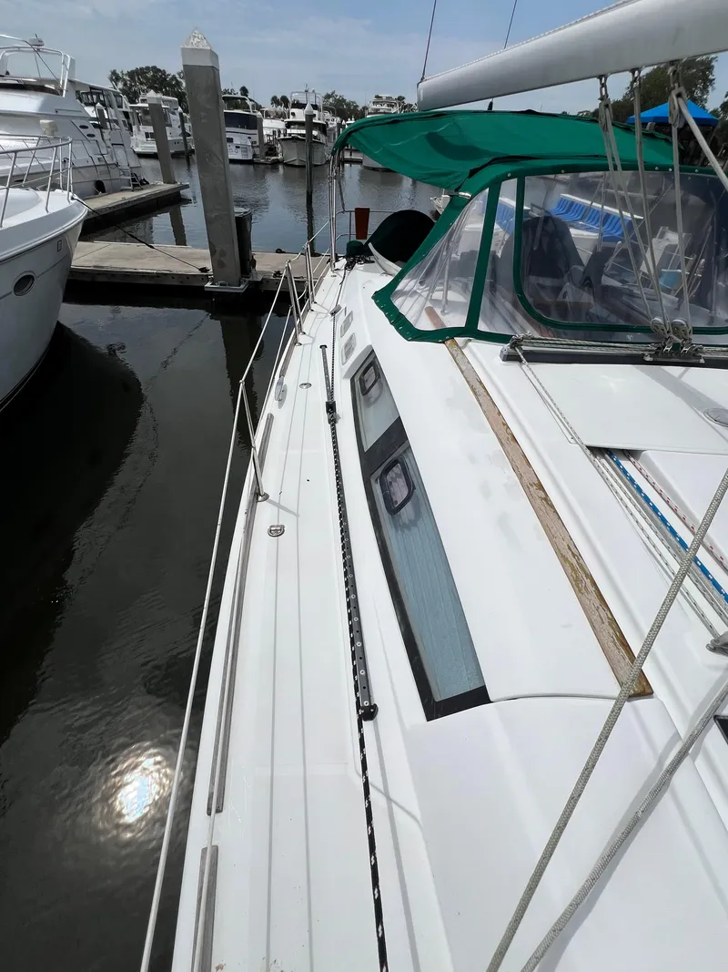 Slide: The Image of 2007 Beneteau Oceanis 46 sailboat docked at marina, side view. - 28