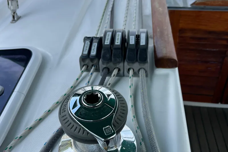 Slide: The Image of Winch and rope clutches on a 2007 Beneteau Oceanis 46 sailboat deck. - 37