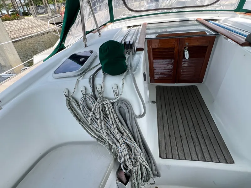 Slide: The Image of Cockpit of 2007 Beneteau Oceanis 46 sailboat with ropes and wooden storage. - 41