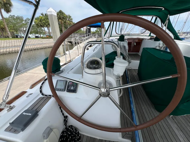 Slide: The Image of Cockpit of 2007 Beneteau Oceanis 46 sailboat with steering wheel and navigation instruments. - 44