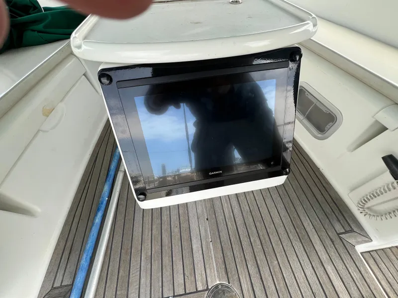 Slide: The Image of Beneteau Oceanis 46 cockpit with navigation display, 2007 model, featuring teak flooring. - 47