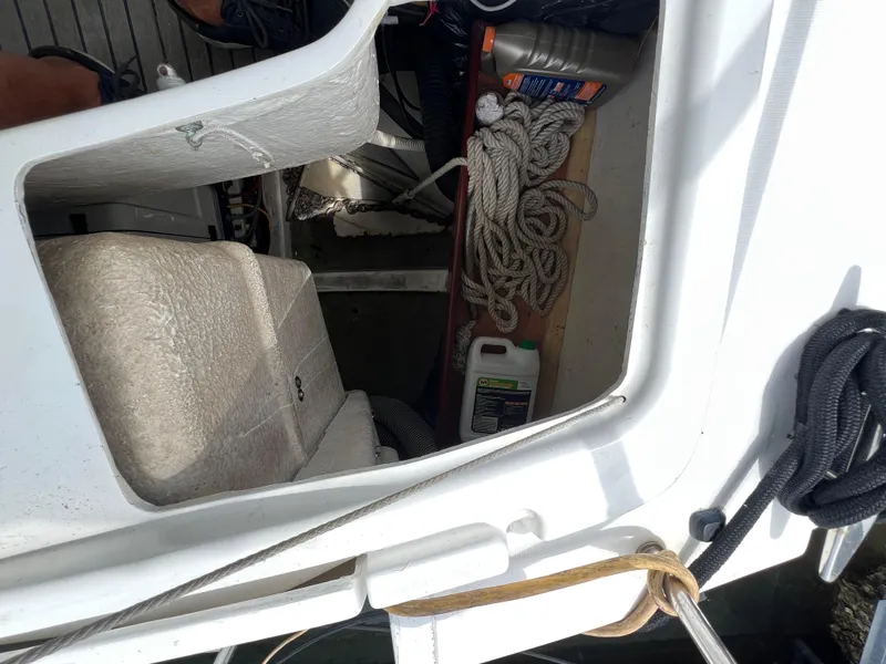 Slide: The Image of Beneteau Oceanis 46 (2007) cockpit storage with ropes and maintenance supplies. - 49