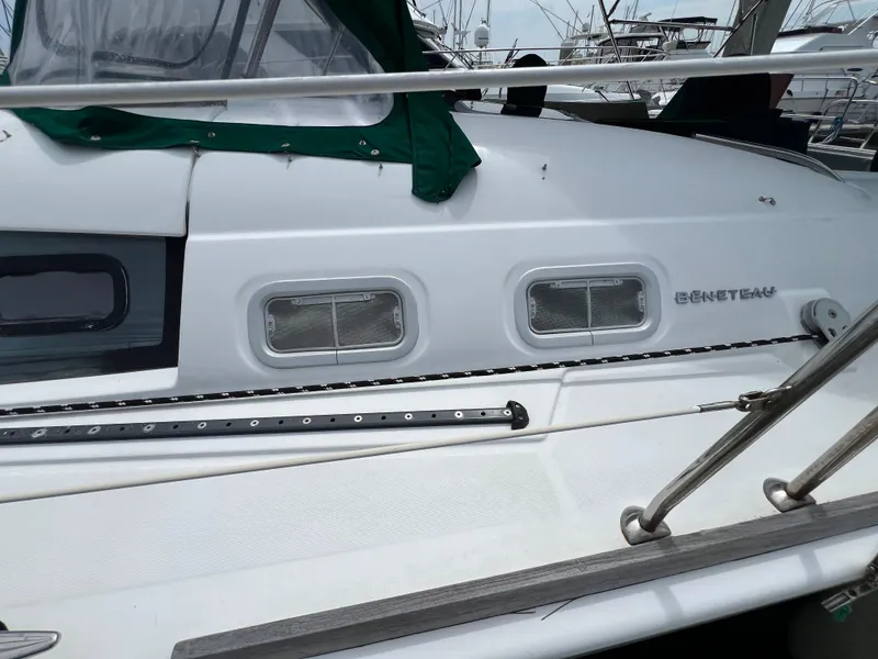 Slide: The Image of 2007 Beneteau Oceanis 46 yacht deck with windows and railing. - 5
