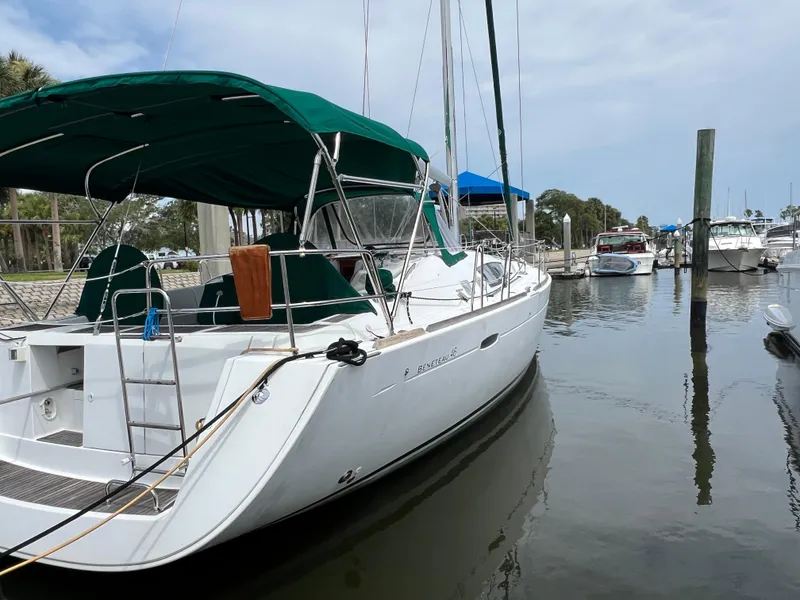 Slide: The Image of 2007 Beneteau Oceanis 46 sailboat docked at marina with green canopy. - 6