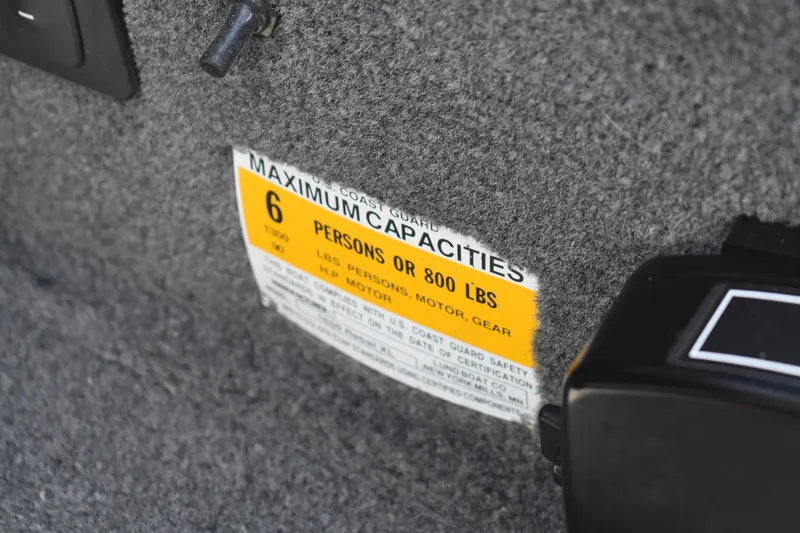 Slide: The Image of Capacity label on 2014 Lund 1650 Rebel XL Sport, indicating 6 persons or 800 lbs. - 11