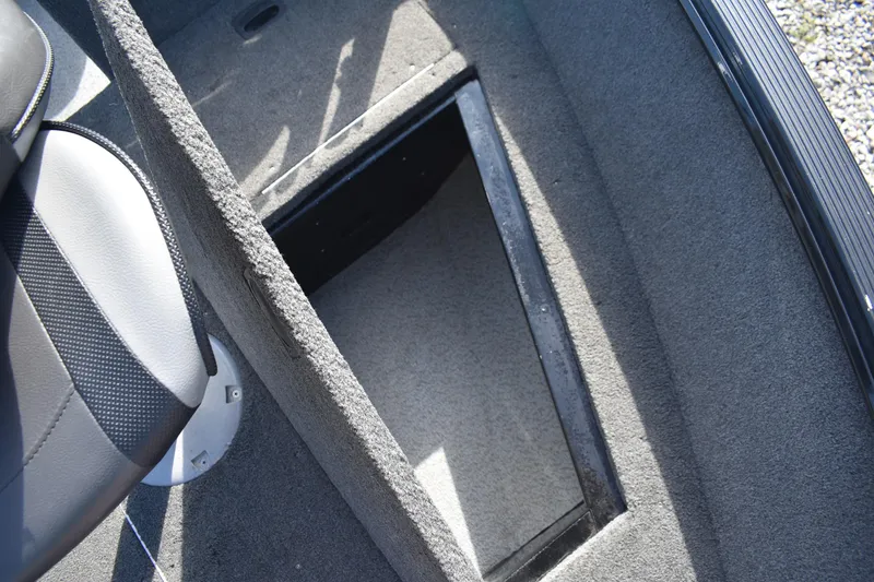 Slide: The Image of 2014 Lund 1650 Rebel XL Sport boat interior storage compartment. - 13