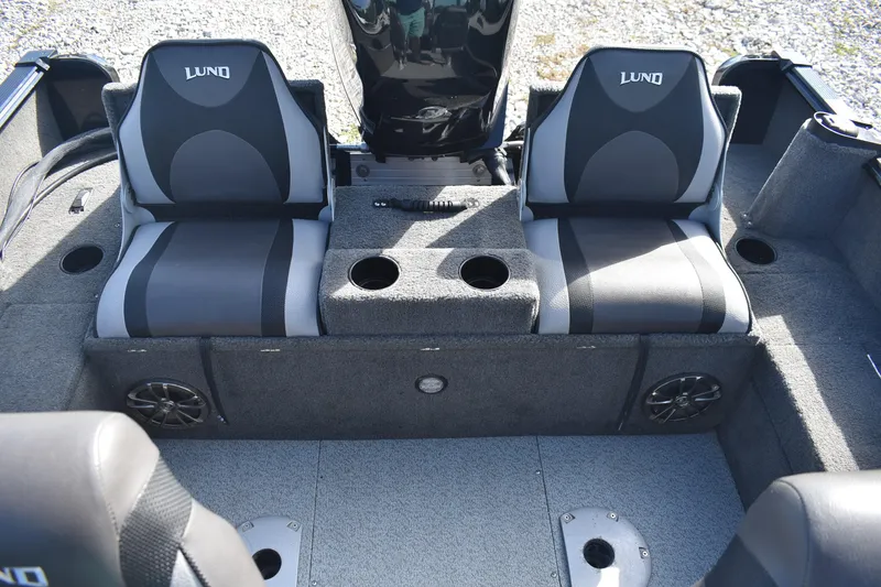 Slide: The Image of 2014 Lund 1650 Rebel XL Sport boat interior with dual seats and cup holders. - 19
