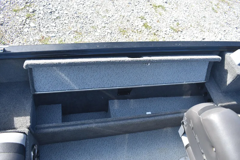 Slide: The Image of 2014 Lund 1650 Rebel XL Sport boat interior storage compartment. - 20