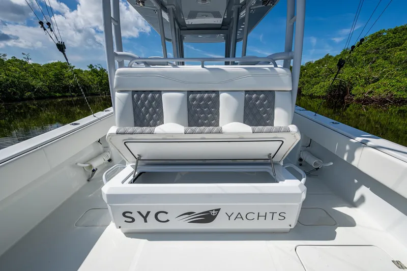 Slide: The Image of 2025 Invincible 33 Catamaran with open storage, sleek design, and luxurious seating. - 10