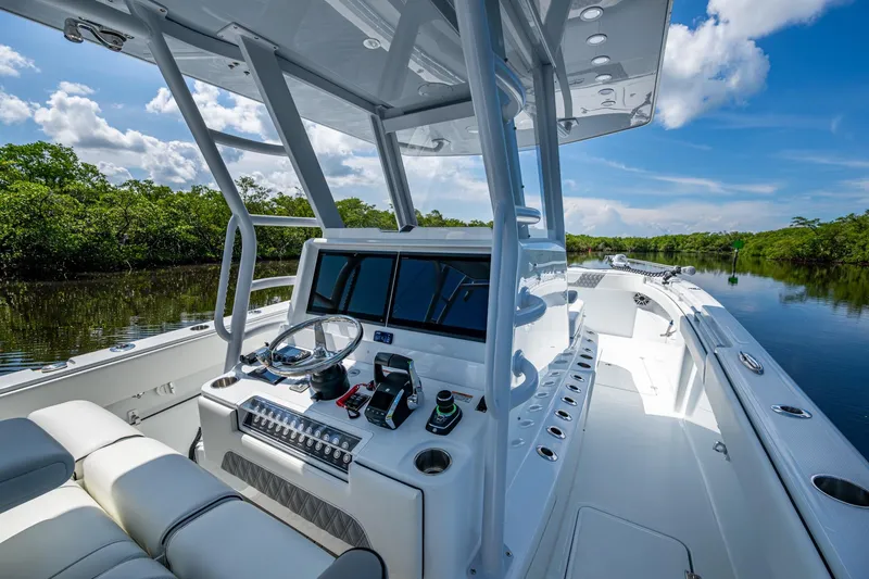 Slide: The Image of 2025 Invincible 33 Catamaran interior, featuring sleek design and advanced navigation controls. - 5