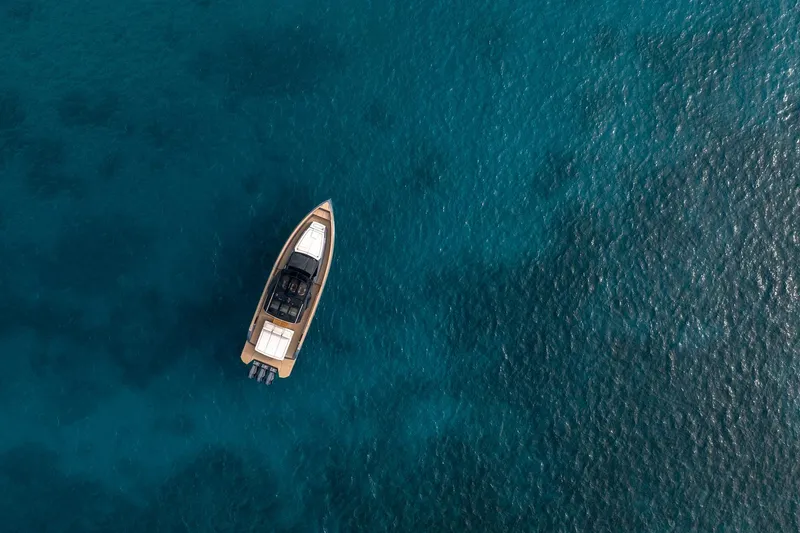 Slide: The Image of Aerial view of 2026 Pardo Yachts P43R on clear blue water. - 31
