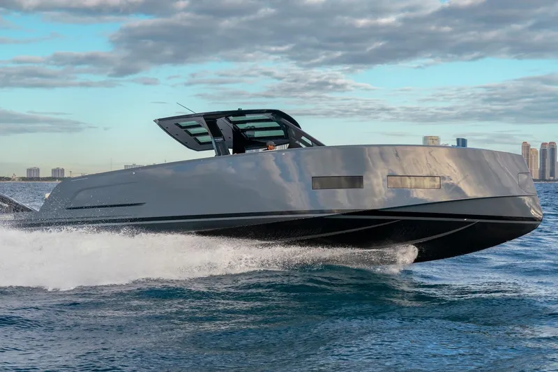 Slide: The Image of 2026 Pardo Yachts P43R cruising on open water under a partly cloudy sky. - 35