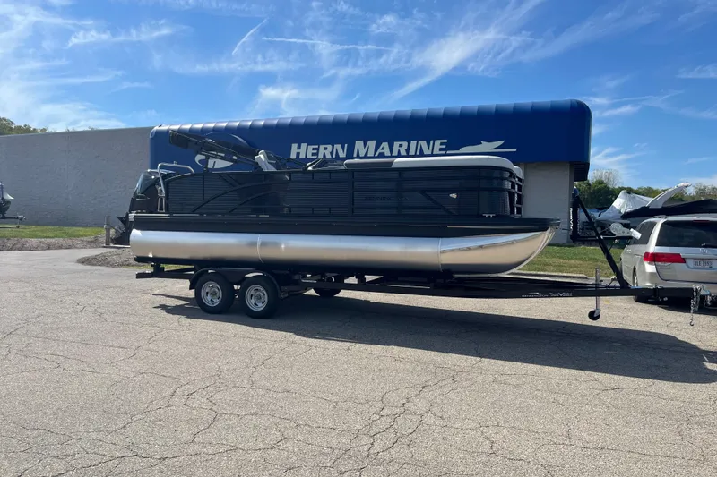 The Image of 2026 Bennington S Line pontoon boat on trailer at Hern Marine dealership. - 0