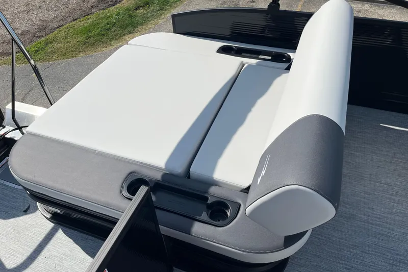 Slide: The Image of 2026 Bennington S Line boat seat with gray and white upholstery, featuring cup holders. - 14