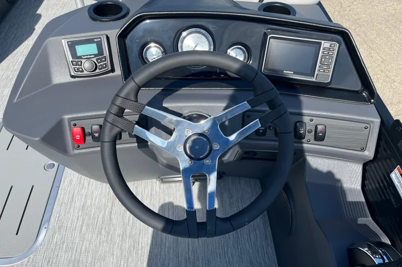 Slide: The Image of Steering console of 2026 Bennington S Line boat with modern controls and gauges. - 7