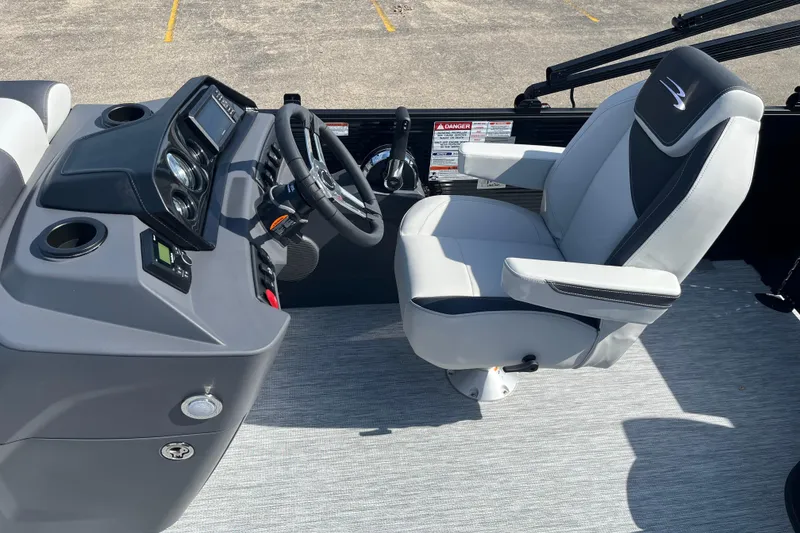 Slide: The Image of 2026 Bennington S Line boat cockpit with modern steering and comfortable seating. - 9