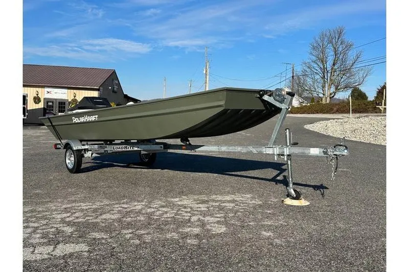 Slide: The Image of 2024 Polar Kraft 1448 Jon Boat with trailer, parked outdoors on a sunny day. - 1