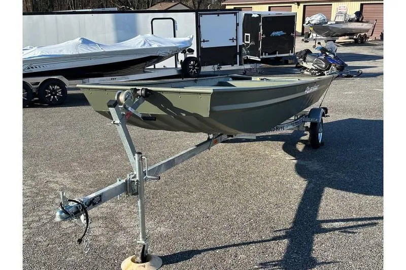 Slide: The Image of 2024 Polar Kraft 1448 Jon Boat with trailer, parked outdoors. - 4