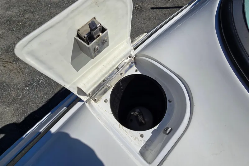 Slide: The Image of Open fuel cap on a 1996 Cobalt 220 boat, showing the fuel inlet. - 20