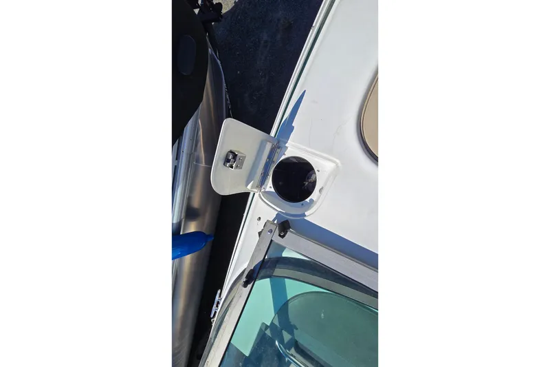 Slide: The Image of Open hatch on 1996 Cobalt 220 boat deck, showing interior compartment. - 21