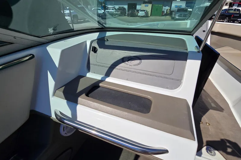 Slide: The Image of Interior of a 1996 Cobalt 220 boat, featuring seating and dashboard details. - 23