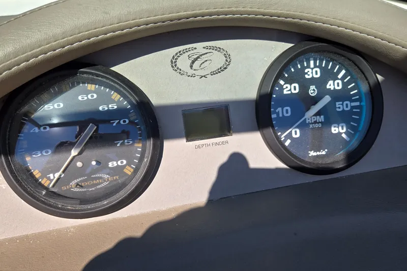 Slide: The Image of Dashboard of a 1996 Cobalt 220 boat with speedometer and RPM gauges. - 26
