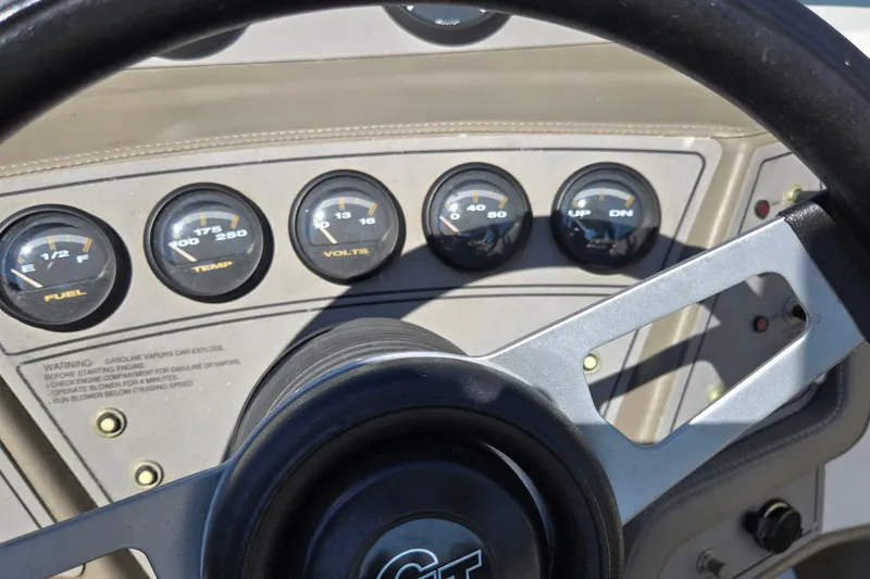 Slide: The Image of Dashboard of a 1996 Cobalt 220 boat with fuel, temperature, and voltage gauges. - 27