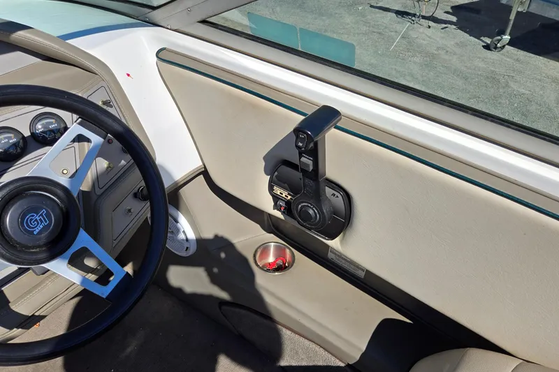 Slide: The Image of Interior of a 1996 Cobalt 220 boat showing steering wheel and control panel. - 29