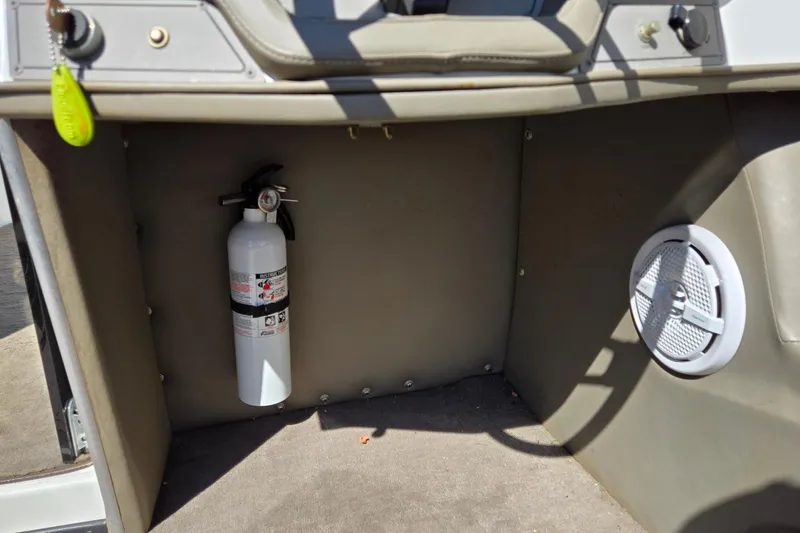 Slide: The Image of Interior of a 1996 Cobalt 220 boat with fire extinguisher and speaker. - 30