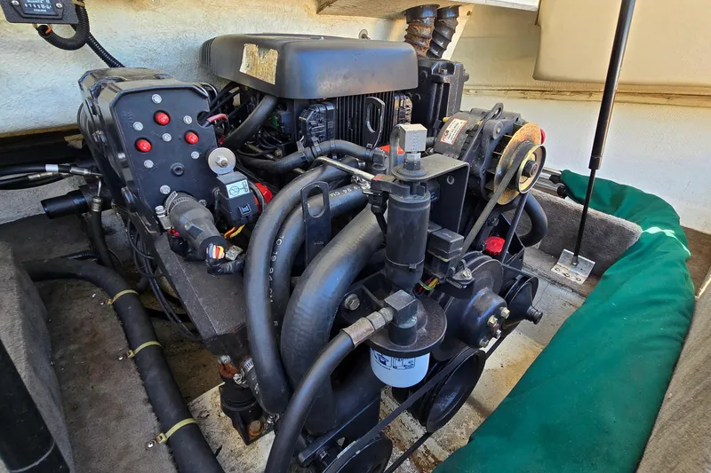 Slide: The Image of Engine compartment of a 1996 Cobalt 220 boat, showcasing mechanical components and wiring. - 38