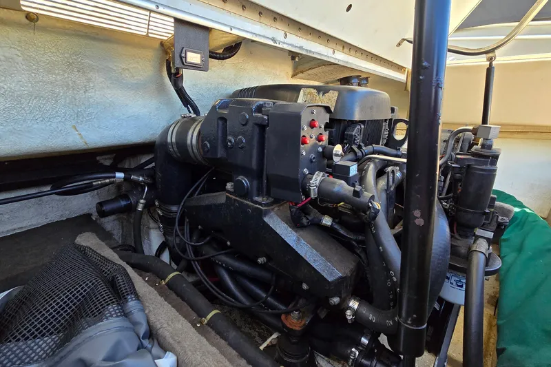 Slide: The Image of Engine compartment of a 1996 Cobalt 220 boat, showcasing mechanical components and wiring. - 40
