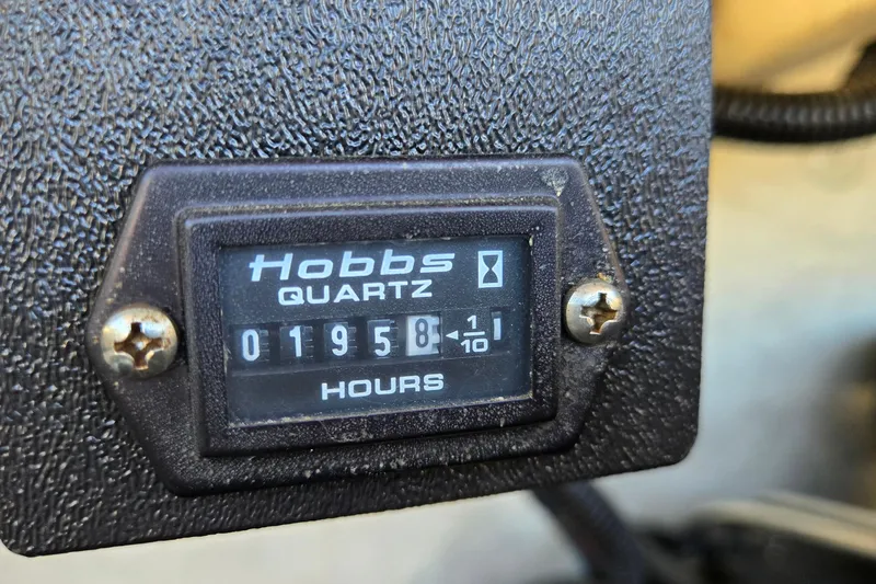 Slide: The Image of Hobbs meter showing 1958 hours on 1996 Cobalt 220 boat. - 43