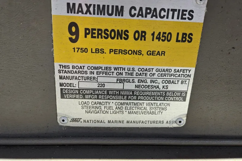 Slide: The Image of Capacity label for 1996 Cobalt 220 boat, max 9 persons or 1450 lbs. - 44