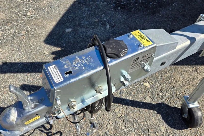 Slide: The Image of Trailer hitch and surge actuator on gravel, Cobalt 220, 1996 model. - 46