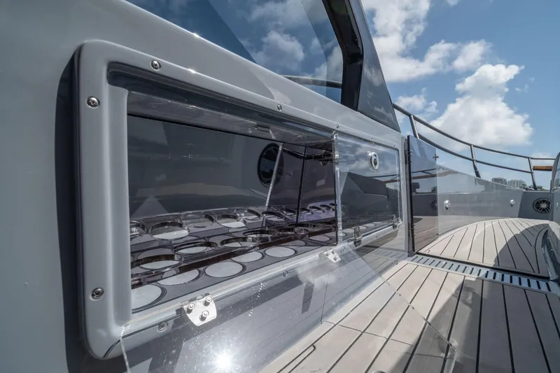 Slide: The Image of 2025 Hanover 387 yacht deck with sleek design and modern features under blue sky. - 15