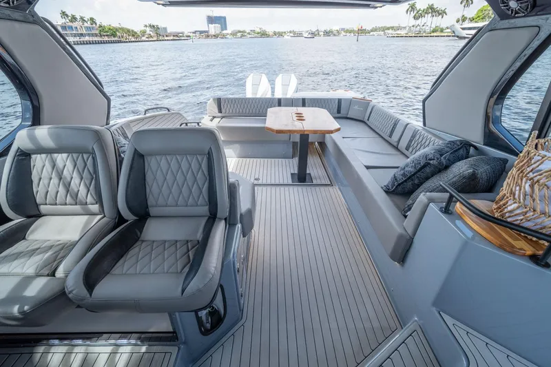 Slide: The Image of Luxurious interior of 2025 Hanover 387 yacht with elegant seating and scenic water view. - 21