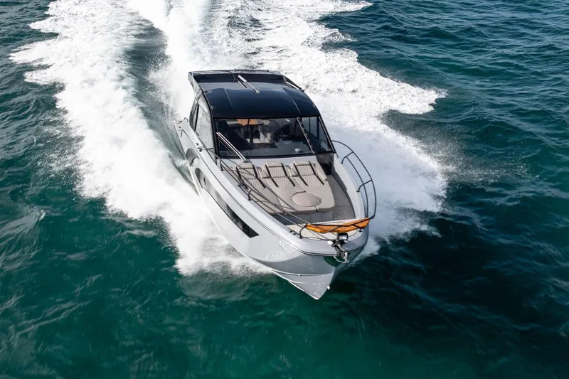 Slide: The Image of 2025 Hanover 387 yacht cruising on open water, showcasing sleek design and powerful performance. - 9